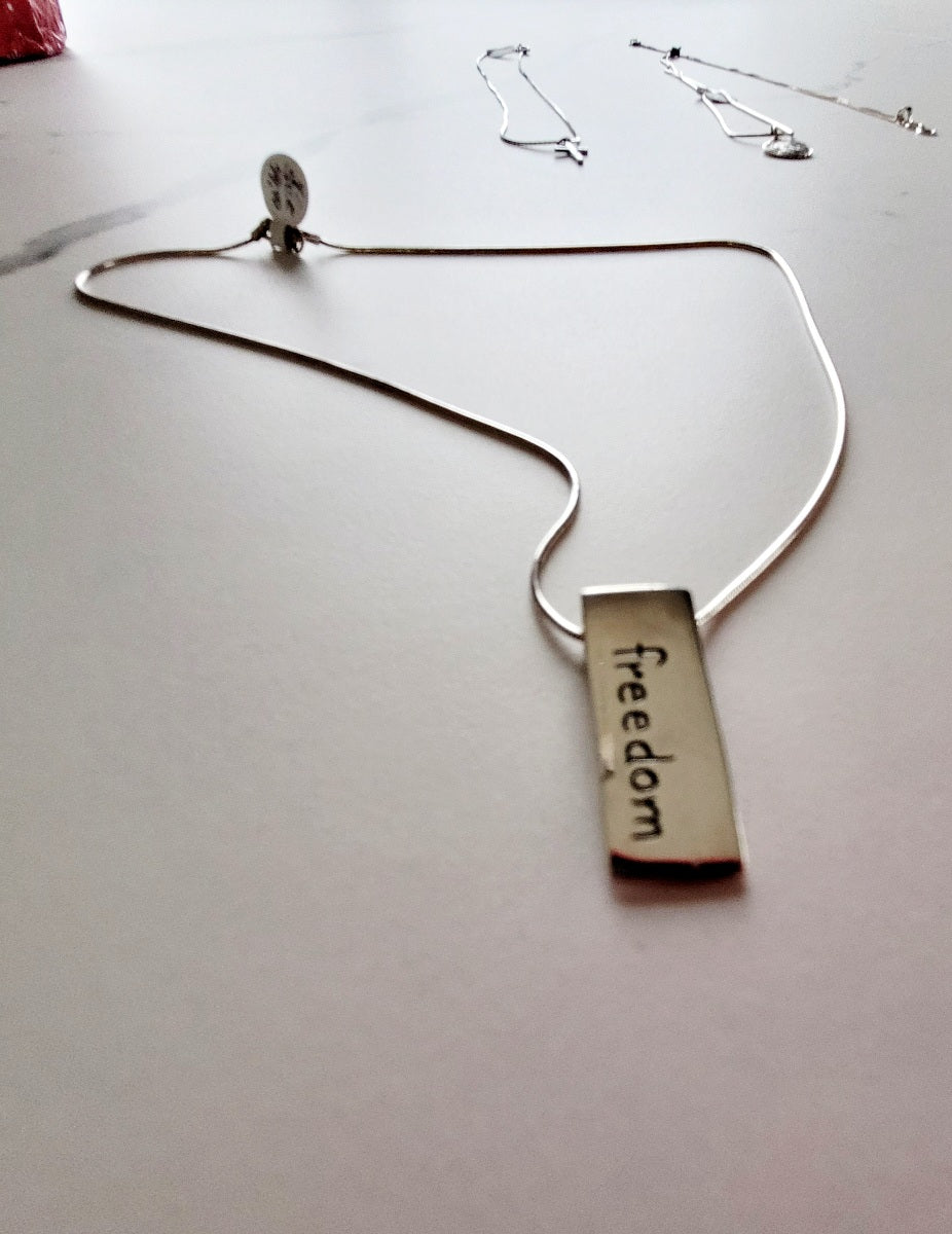 Sterling Silver necklace with Freedom pendant