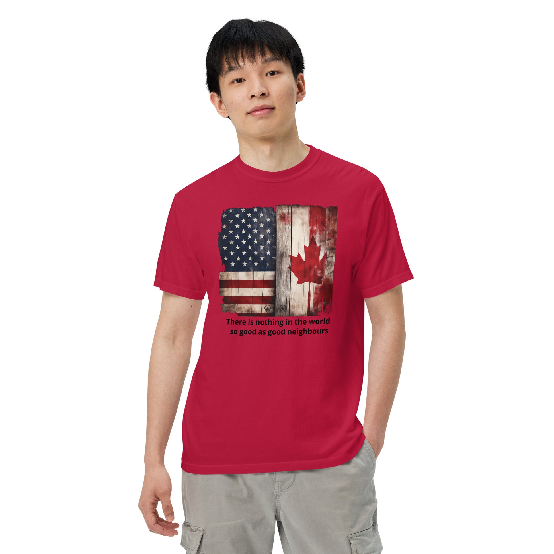 Person wearing a red t-shirt with a graphic design of an American and Canadian flag  Indigenous Art