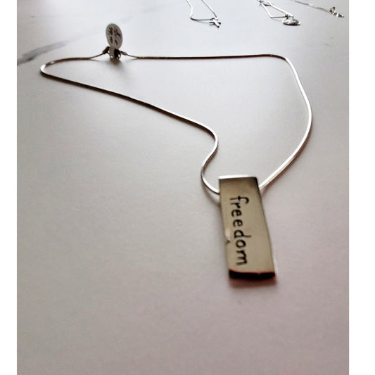 Sterling Silver necklace with Freedom pendant